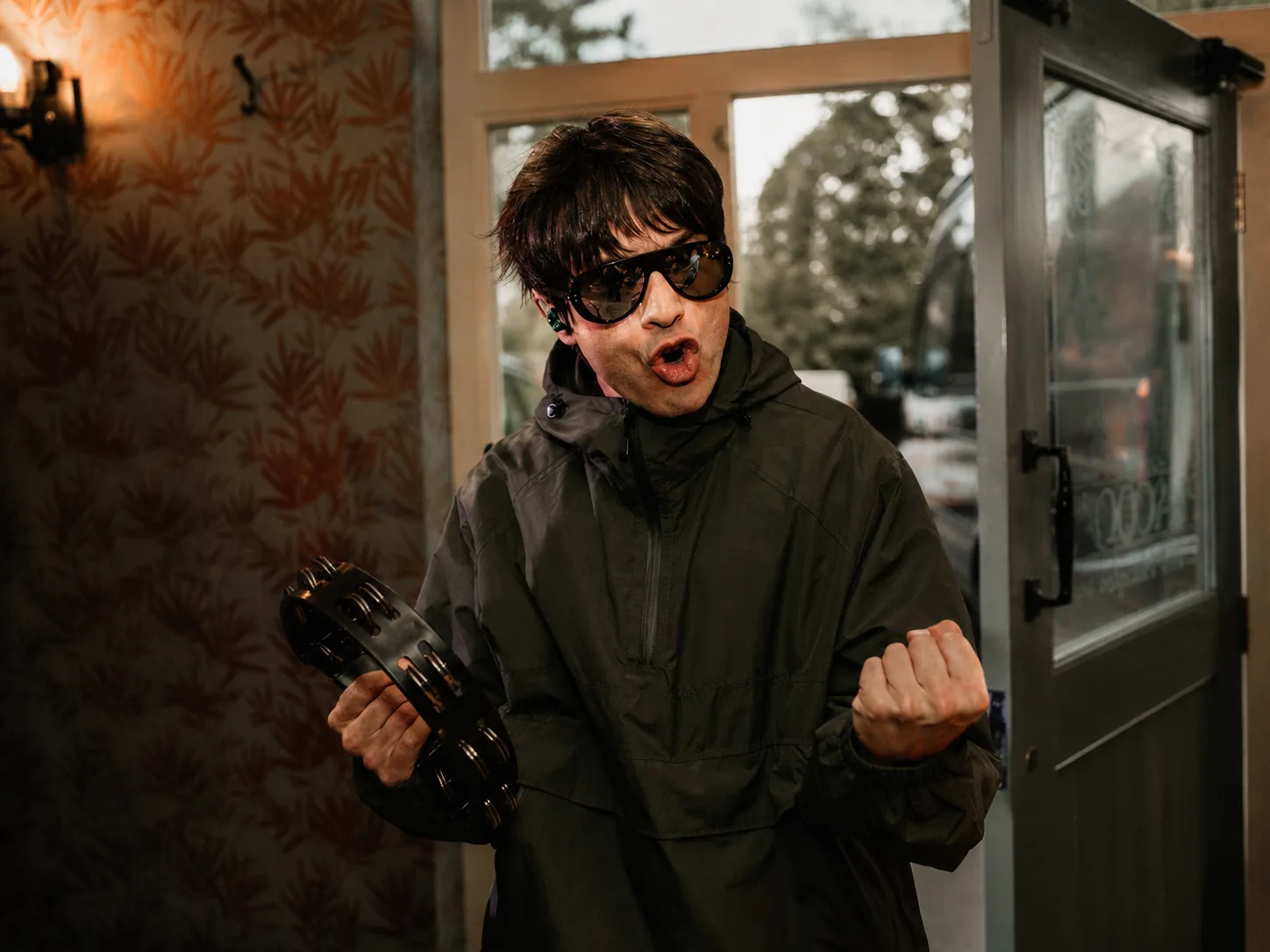 Liar Gallagher with tambourine at a private event